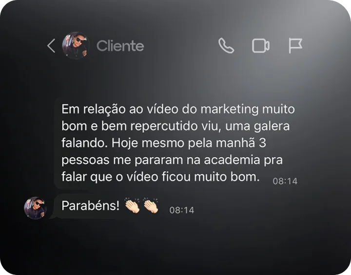 Print de conversa no WhatsApp. Mensagem do cliente: "Em relação ao vídeo do marketing muito bom e bem repercutido viu, uma galera falando. Hoje mesmo pela manhã 3 pessoas me pararam na academia pra falar que o vídeo ficou muito bom." Resposta: "Parabéns!"